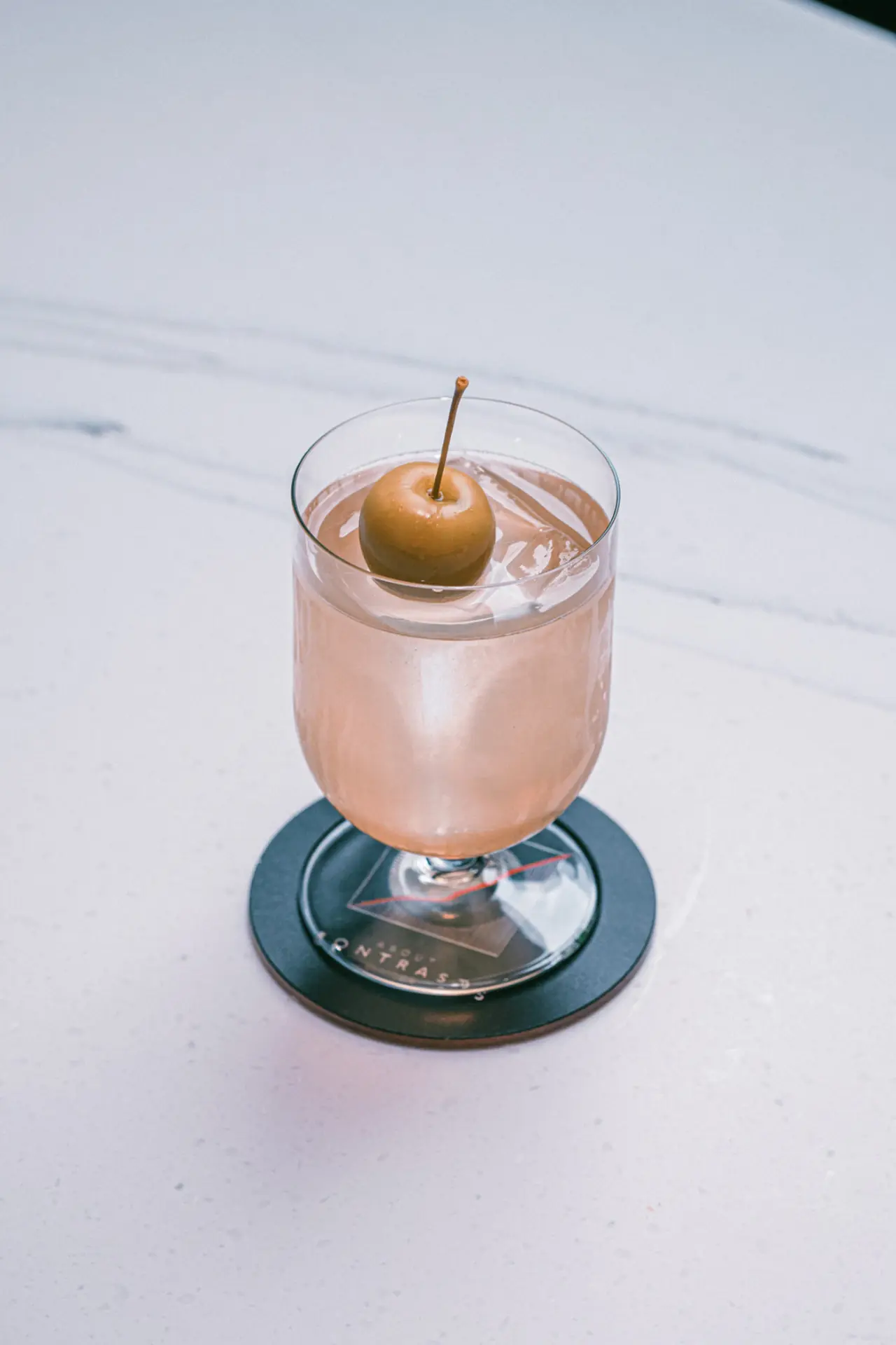 An apple-garnished cocktail